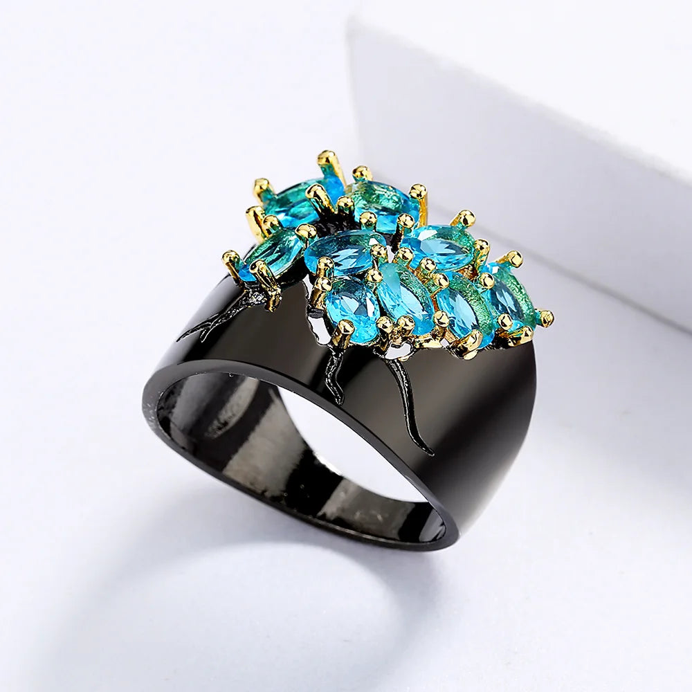 Medieval Black RIng with Green Zircon Gemstones